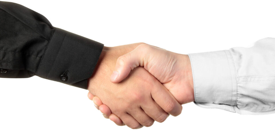 Businessmen shaking hands isolated on white background