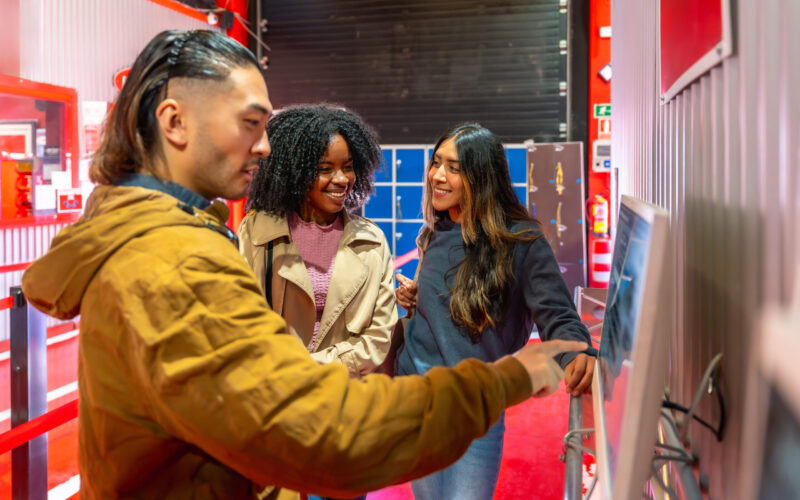 friends-exploring-an-interactive-museum-exhibit-to-2026-03-05-11-49-52-utc (1)